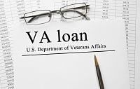 Paper with VA loan on a table
